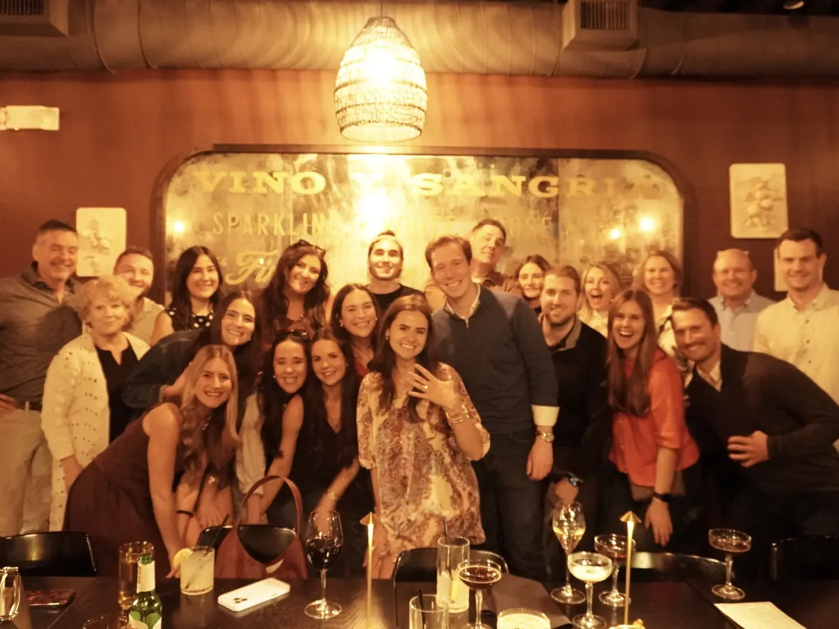 Ben and Kenz with family and friends celebrating the engagement